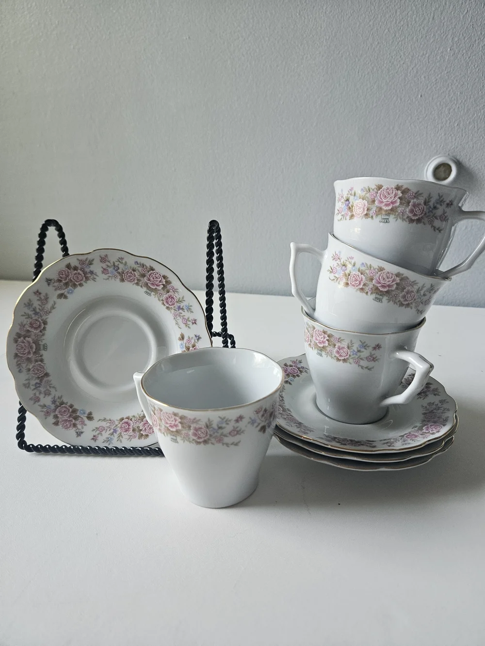 Fine China tea cup and saucer set, featuring pink floral designs and gold trim.